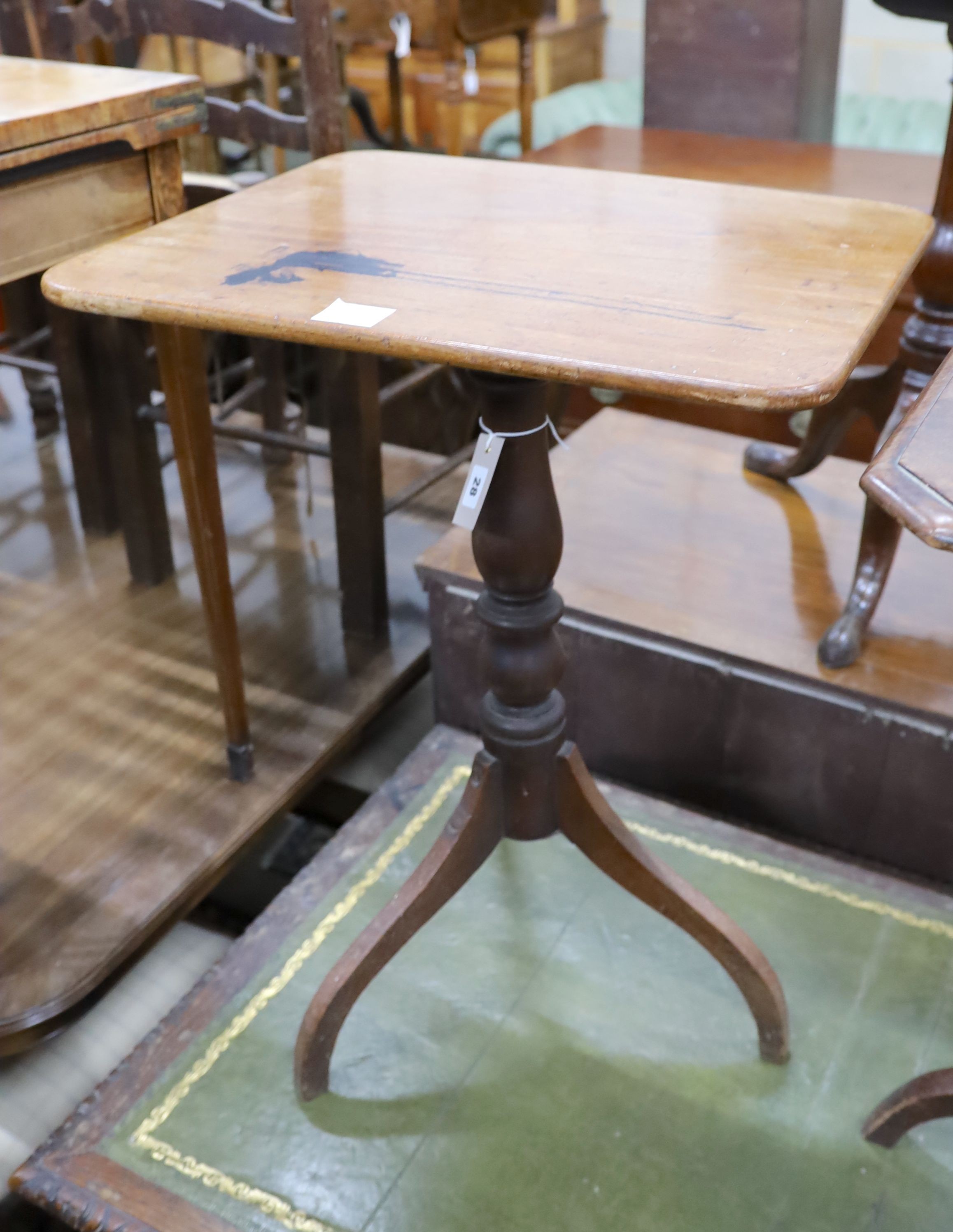 A Victorian rectangular mahogany tilt top wine table, on an inverted triple splay leg base, width 53cm, depth 42cm, height 71cm